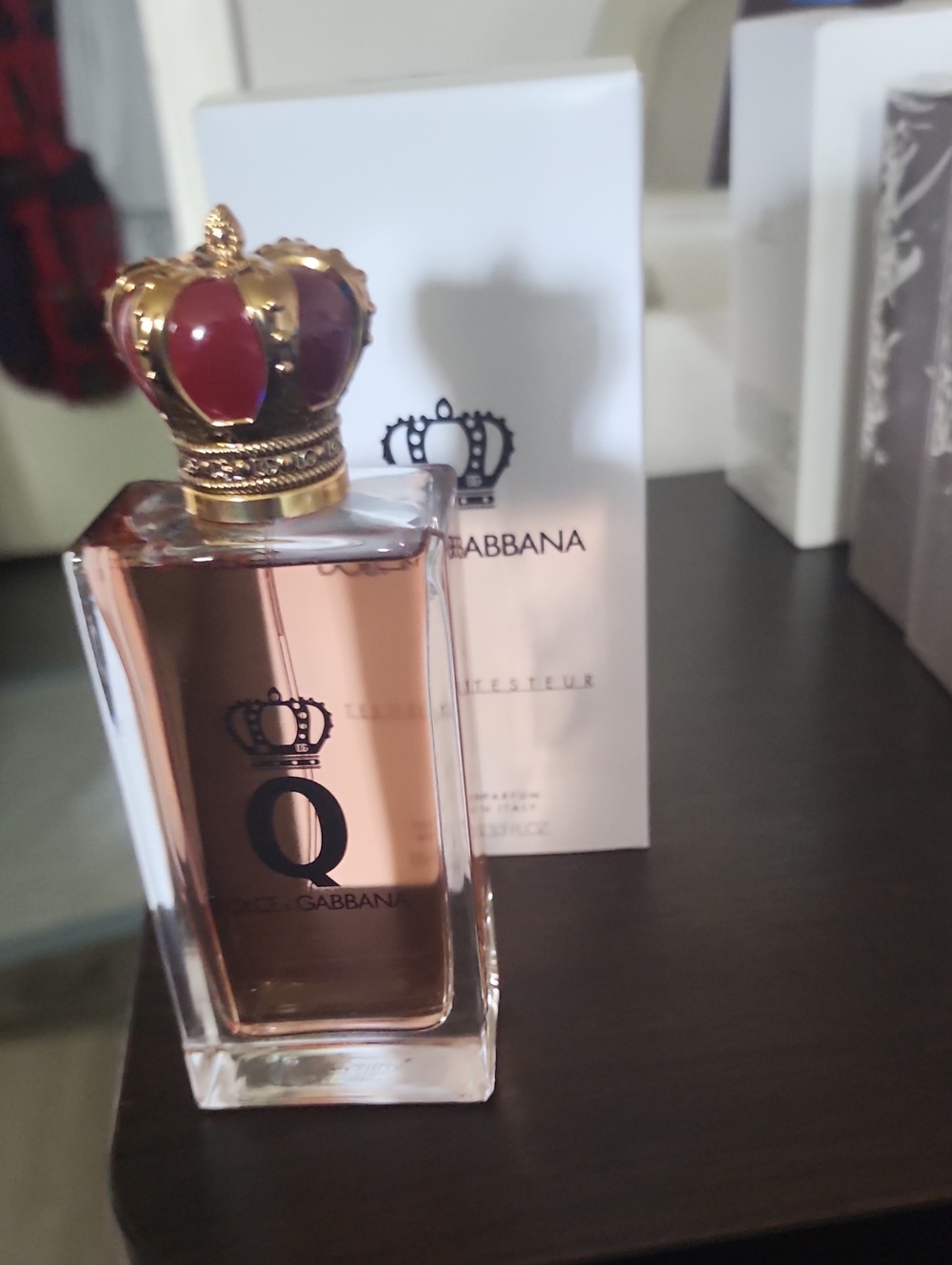 Dolce & Gabbana perfume bottle in rose gold and gold crown